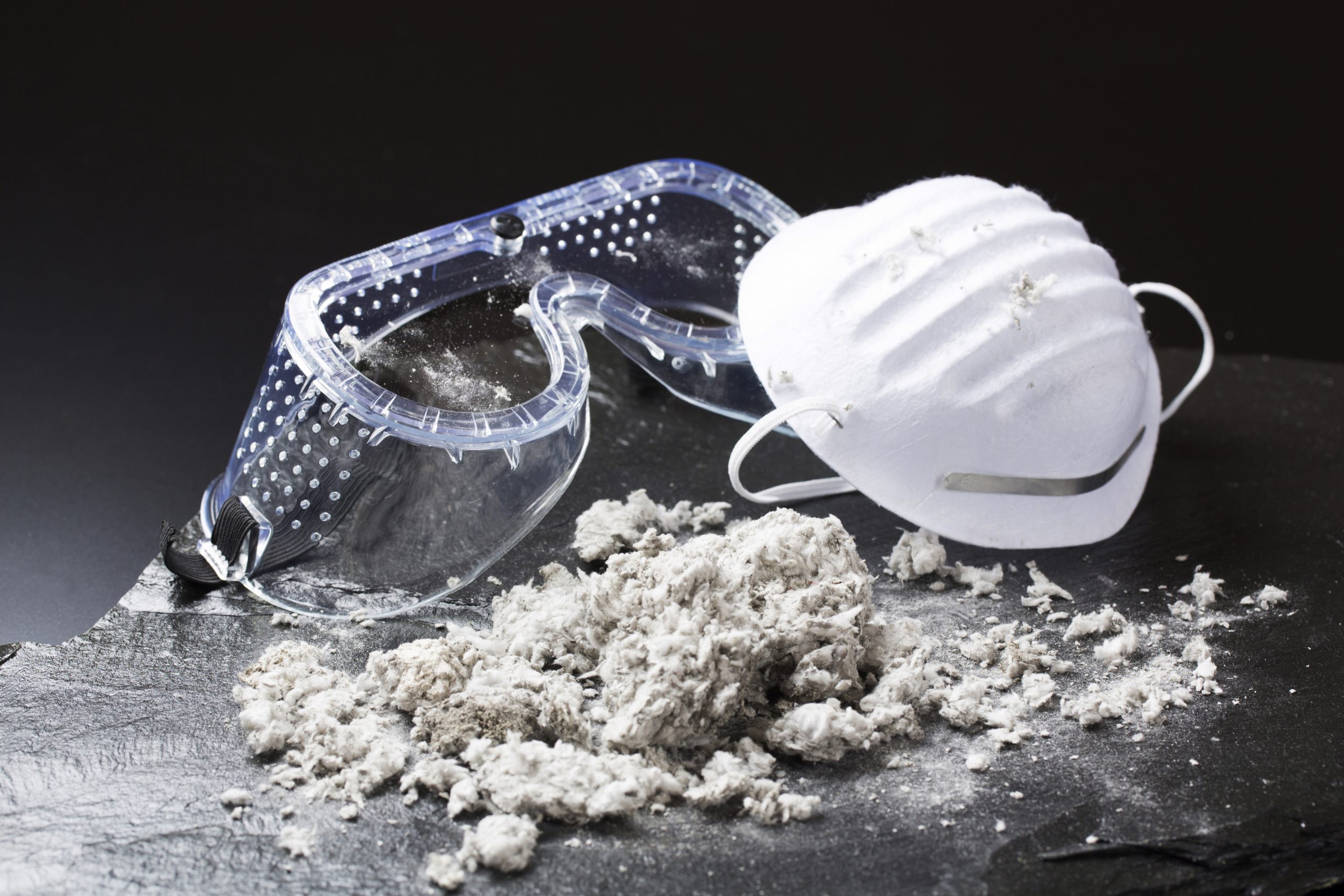 5 reasons to test for asbestos blog image of asbestos and mask
