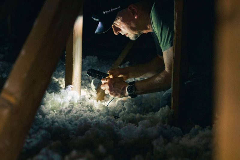 image of man checking asbestos insulation