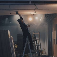image of worker assessing asbestos ceiling