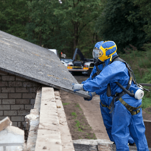 Person safely remvoing asbestos at a asbestos removal service. 